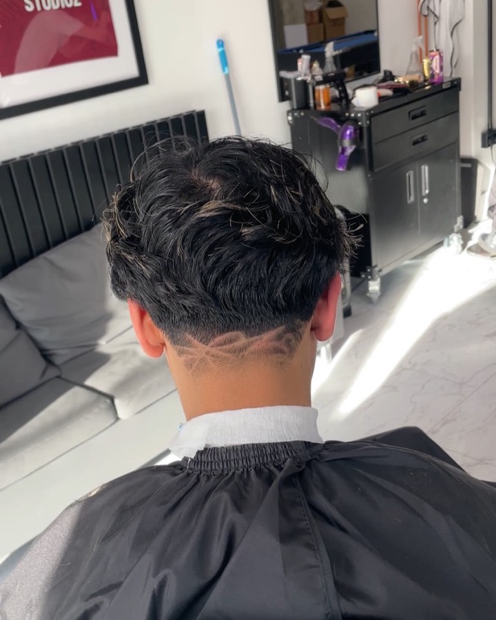 Back view of a textured cut with a tapered neckline