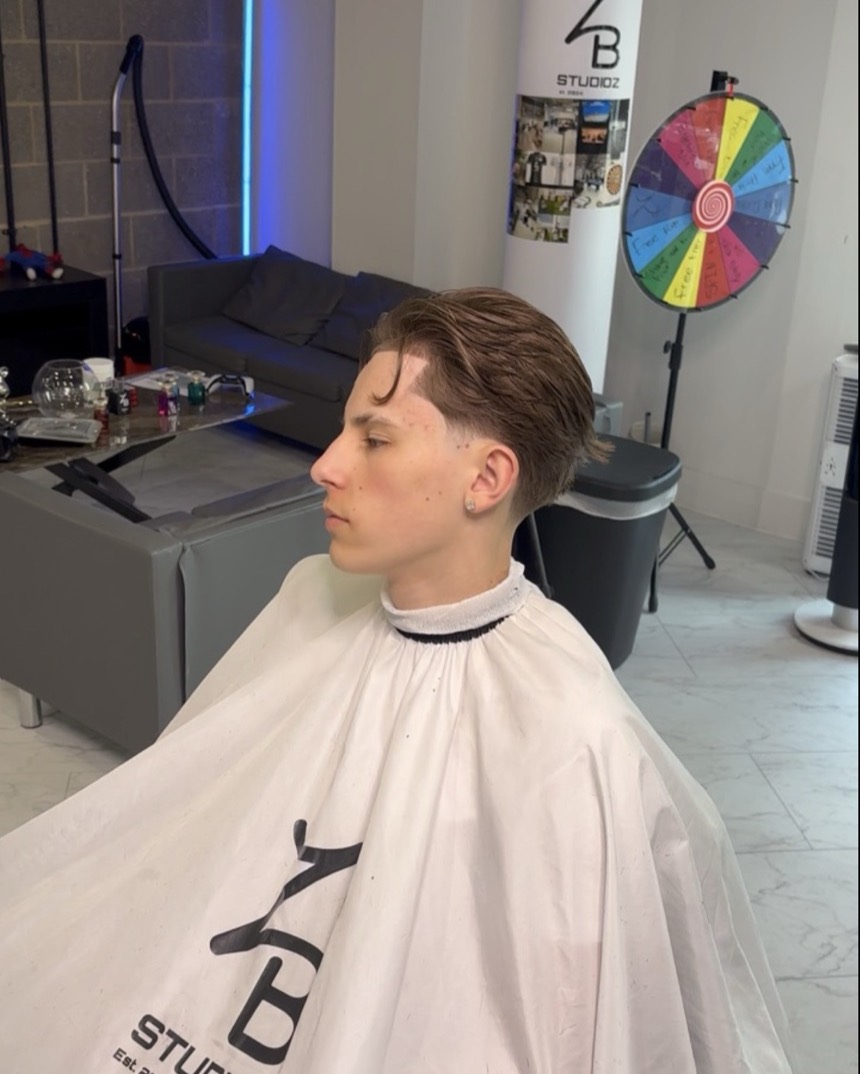 Client in a ZB Studioz cape after a scissor cut and taper